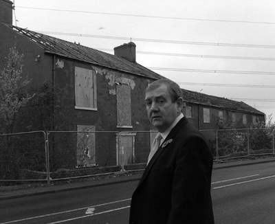 Alan Lewis outside the derelict building