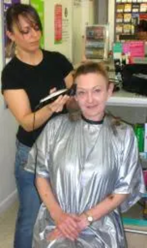 Julia having her head shaved for charity