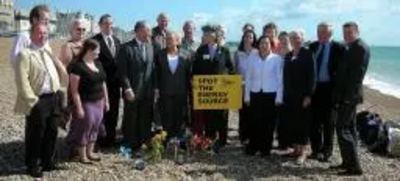 Fiona Hall MEP and North East Lib Dems on beach demonstrating wind, sun & waves as energy sources.